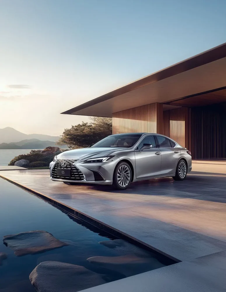Silver sedan with a clean, glossy finish parked outside a modern building